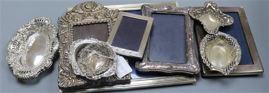 Five silver mounted photograph frames, four pierced silver nut dishes and a pair of plated nut dishes.